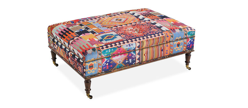 Taylor King Ottoman in a very colorful patterned fabric